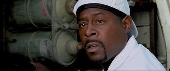 Movie still from “Bad Boys II” (2003), directed by Michael Bay – A person wearing a white hat; Close Up shot, Low angle