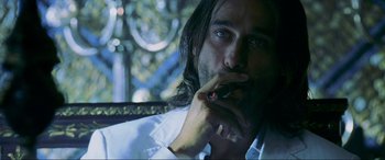 Movie still from “Bad Boys II” (2003), directed by Michael Bay – A person smoking a cigarette; Close Up shot, Low angle