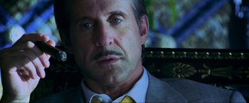 Movie still from “Bad Boys II” (2003), directed by Michael Bay – A person wearing a suit and tie; Close Up shot, Over the shoulder angle