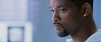 Movie still from “Bad Boys II” (2003), directed by Michael Bay – A man's face with a beard; Close Up shot, Over the shoulder angle