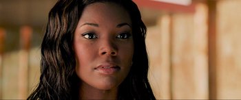 Movie still from “Bad Boys II” (2003), directed by Michael Bay – A woman's face with long black hair; Close Up shot, High angle