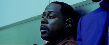 Movie still from “Bad Boys II” (2003), directed by Michael Bay – A person with a beard; Close Up shot, High angle