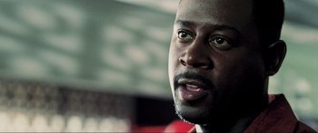 Movie still from “Bad Boys II” (2003), directed by Michael Bay – A man's face with green eyes; Close Up shot, Low angle