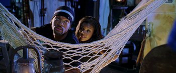 Movie still from “Bad Boys II” (2003), directed by Michael Bay – A man and a woman laying in a hammock; Medium shot, High angle