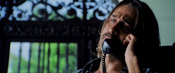 Movie still from “Bad Boys II” (2003), directed by Michael Bay – A person talking on a phone; Close Up shot, Low angle