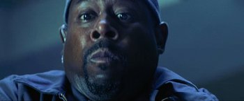 Movie still from “Bad Boys II” (2003), directed by Michael Bay – A man's face in the dark; Extreme Close Up shot, Low angle