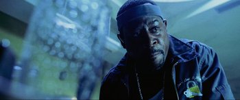 Movie still from “Bad Boys II” (2003), directed by Michael Bay – A person wearing a headband; Close Up shot, Low angle