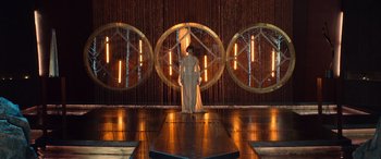 Movie still from “Barb and Star Go to Vista Del Mar” (2021), directed by Josh Greenbaum – A man standing in front of a stage with lights; Extreme Wide shot, High angle