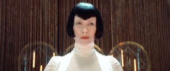 Movie still from “Barb and Star Go to Vista Del Mar” (2021), directed by Josh Greenbaum – A woman in a white dress and black wig; Close Up shot, Low angle