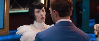 Movie still from “Barb and Star Go to Vista Del Mar” (2021), directed by Josh Greenbaum – A man and a woman are talking to each other; Close Up shot, Over the shoulder angle