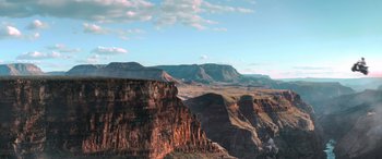 Movie still from “Barb and Star Go to Vista Del Mar” (2021), directed by Josh Greenbaum – A view of a mountain range from the top of a hill; Extreme Wide shot, High angle