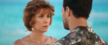 Movie still from “Barb and Star Go to Vista Del Mar” (2021), directed by Josh Greenbaum – A man and a woman are talking to each other; Close Up shot, Over the shoulder angle