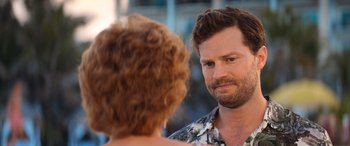 Movie still from “Barb and Star Go to Vista Del Mar” (2021), directed by Josh Greenbaum – A person talking to another person; Close Up shot, Over the shoulder angle