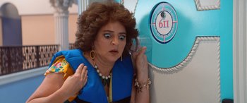 Movie still from “Barb and Star Go to Vista Del Mar” (2021), directed by Josh Greenbaum – A woman in a costume talking on the phone; Close Up shot, Low angle