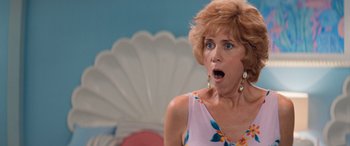 Movie still from “Barb and Star Go to Vista Del Mar” (2021), directed by Josh Greenbaum – An older woman with a surprised look on her face; Close Up shot, Low angle