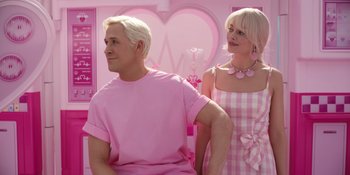 Movie still from “Barbie” (2023), directed by Greta Gerwig – A man and a woman dressed in matching pink clothes; Medium shot, Over the shoulder angle