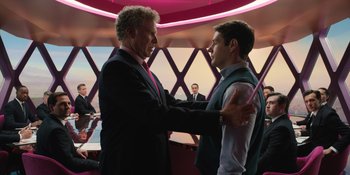 Movie still from “Barbie” (2023), directed by Greta Gerwig – Two men in suits and ties standing next to each other; Medium shot, Over the shoulder angle