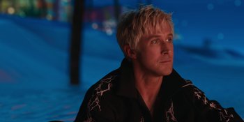 Movie still from “Barbie” (2023), directed by Greta Gerwig – A person wearing a jacket; Close Up shot, Over the shoulder angle