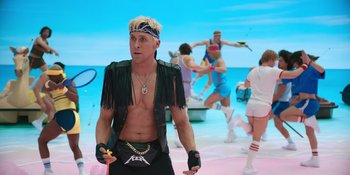 Movie still from “Barbie” (2023), directed by Greta Gerwig – A man in a black jacket and a headband; Medium shot, Over the shoulder angle