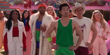 Movie still from “Barbie” (2023), directed by Greta Gerwig – A group of young men standing next to each other; Medium shot, Over the shoulder angle