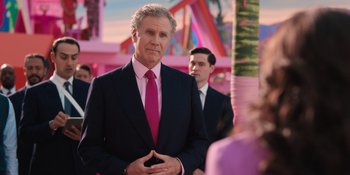 Movie still from “Barbie” (2023), directed by Greta Gerwig – A man in a suit and tie standing next to another man in a suit and tie; Medium shot, Over the shoulder angle