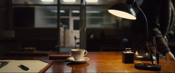 Movie still from “Empire of Light” (2022), directed by Sam Mendes – A coffee cup on the table; Wide shot, High angle