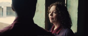 Movie still from “Empire of Light” (2022), directed by Sam Mendes – A woman looking at a man in the mirror; Close Up shot, Over the shoulder angle