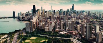 Movie still from “The Judge” (2014), directed by David Dobkin – An aerial view of a large city with skyscrapers; Extreme Wide shot, High angle