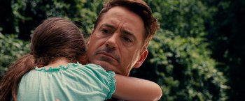 Movie still from “The Judge” (2014), directed by David Dobkin – A person holding a child; Close Up shot, Over the shoulder angle