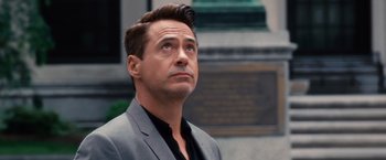 Movie still from “The Judge” (2014), directed by David Dobkin – A person wearing a suit and tie; Close Up shot, Over the shoulder angle