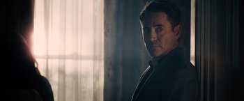 Movie still from “The Judge” (2014), directed by David Dobkin – A person wearing a suit and tie; Close Up shot, Over the shoulder angle