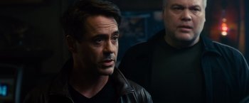 Movie still from “The Judge” (2014), directed by David Dobkin – A man in a black shirt and a man in a black jacket; Close Up shot, Over the shoulder angle