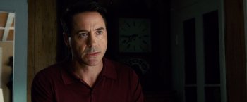 Movie still from “The Judge” (2014), directed by David Dobkin – A person with a clock in the background; Close Up shot, Over the shoulder angle