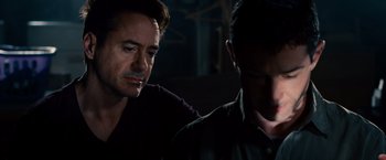 Movie still from “The Judge” (2014), directed by David Dobkin – Two men sitting next to each other in a dark room; Close Up shot, Over the shoulder angle