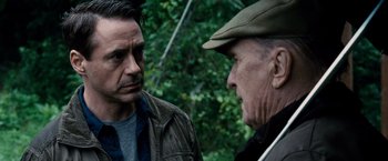 Movie still from “The Judge” (2014), directed by David Dobkin – A man and an older man talking to each other; Close Up shot, Over the shoulder angle