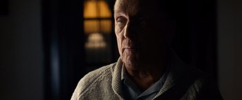 Movie still from “The Judge” (2014), directed by David Dobkin – An older man wearing a sweater looking at the camera; Close Up shot, Over the shoulder angle