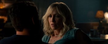 Movie still from “The Judge” (2014), directed by David Dobkin – A woman with blonde hair is looking at the camera; Close Up shot, Over the shoulder angle