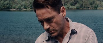 Movie still from “The Judge” (2014), directed by David Dobkin – A person near a body of water; Close Up shot, Over the shoulder angle
