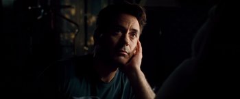Movie still from “The Judge” (2014), directed by David Dobkin – A person with his hand under his chin; Close Up shot, Over the shoulder angle
