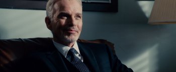 Movie still from “The Judge” (2014), directed by David Dobkin – A person wearing a suit and tie; Close Up shot, Over the shoulder angle