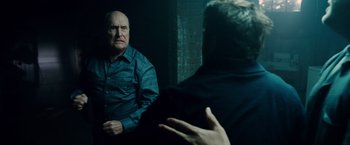 Movie still from “The Judge” (2014), directed by David Dobkin – An older man sitting in front of a mirror in front of another older man; Medium shot, Over the shoulder angle