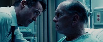 Movie still from “The Judge” (2014), directed by David Dobkin – A man and an older man face each other in a room; Close Up shot, Over the shoulder angle