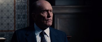 Movie still from “The Judge” (2014), directed by David Dobkin – An older man wearing a suit and tie; Close Up shot, Low angle
