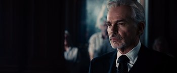 Movie still from “The Judge” (2014), directed by David Dobkin – An older man in a suit and tie looking at the camera; Close Up shot, Over the shoulder angle