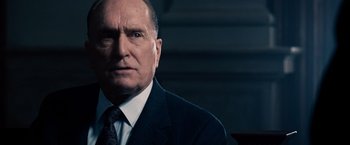 Movie still from “The Judge” (2014), directed by David Dobkin – An older man wearing a suit and tie; Close Up shot, Low angle