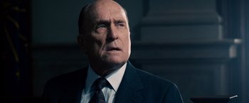 Movie still from “The Judge” (2014), directed by David Dobkin – An older man wearing a suit and tie; Close Up shot, Low angle