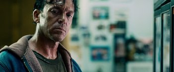 Movie still from “The Judge” (2014), directed by David Dobkin – A person wearing a green shirt; Close Up shot, Low angle