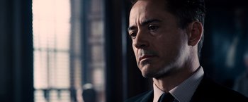 Movie still from “The Judge” (2014), directed by David Dobkin – A person wearing a suit and tie; Close Up shot, Over the shoulder angle