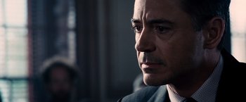 Movie still from “The Judge” (2014), directed by David Dobkin – A person wearing a suit and tie; Close Up shot, Over the shoulder angle