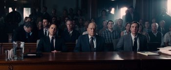 Movie still from “The Judge” (2014), directed by David Dobkin – A group of people sitting in a court room; Wide shot, High angle